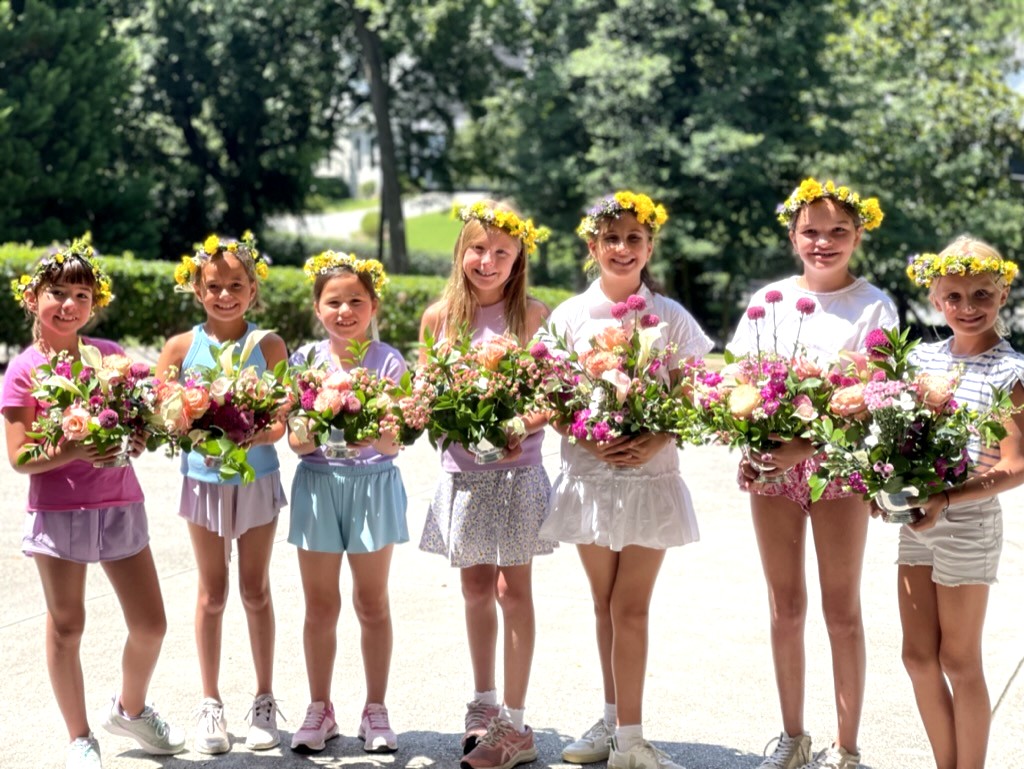 Whimsy Camp campers with their floral arrangements